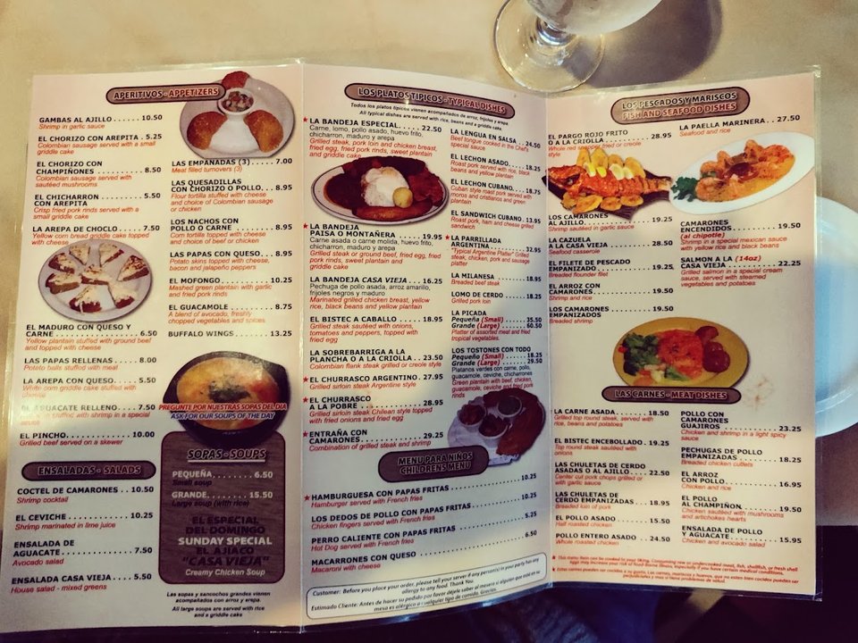 Dining tables inside a casual Colombian restaurant.