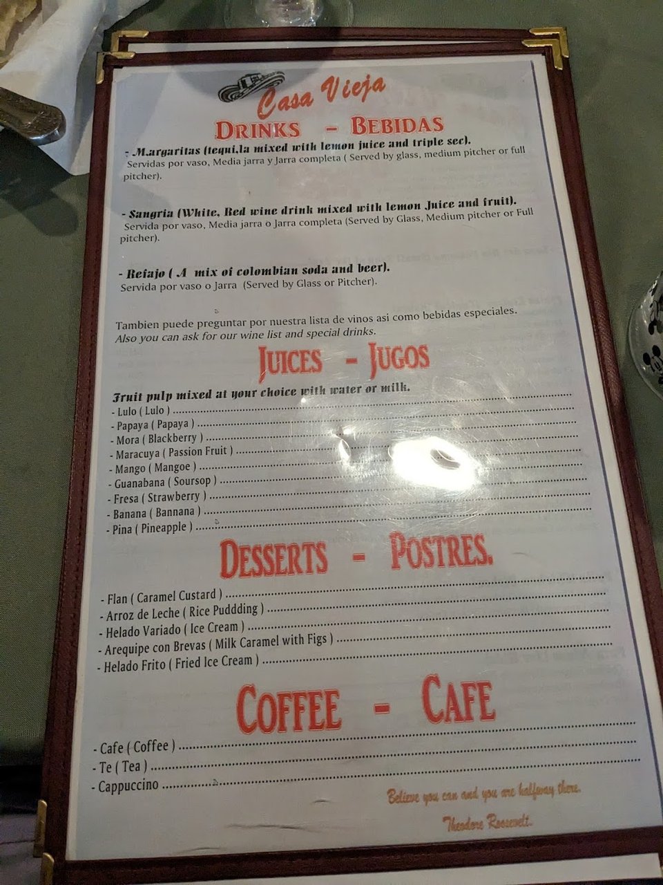 Printed menu featuring seafood and grilled plates.
